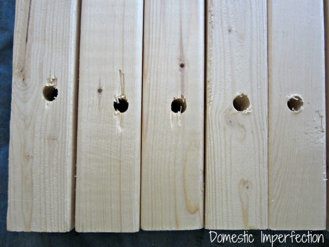 holes drilled into wooden door mat