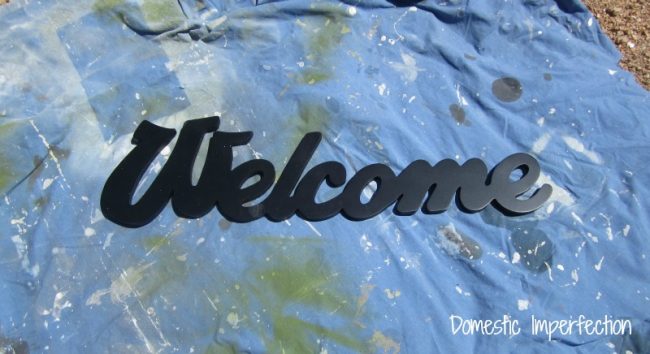 spray painted welcome sign