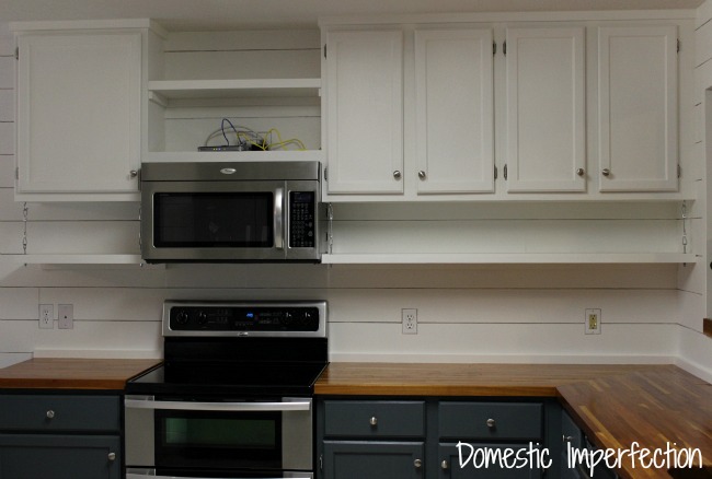 open shelving below cabinets