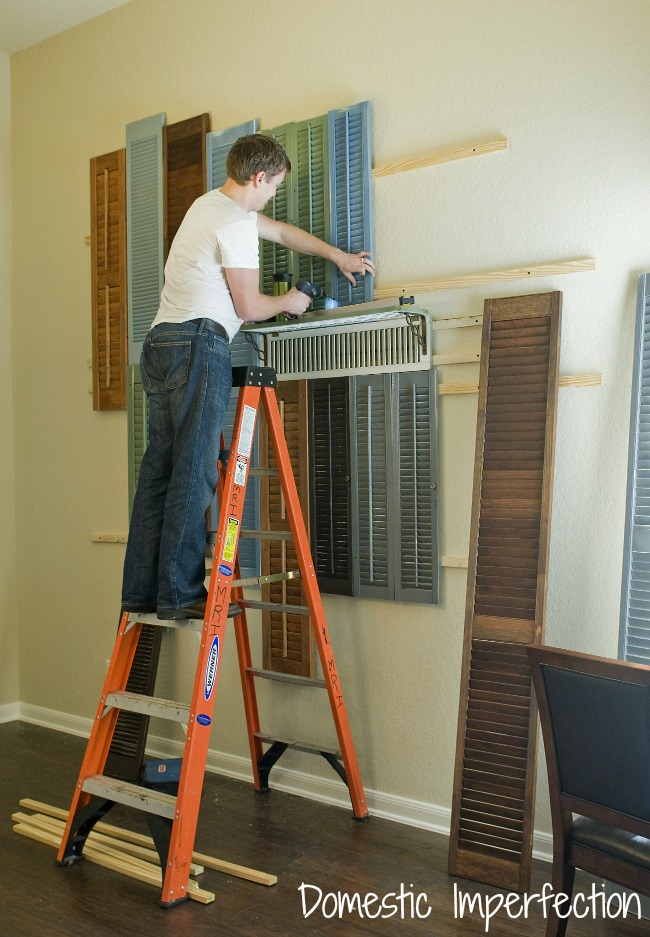 attaching shutters to the wall