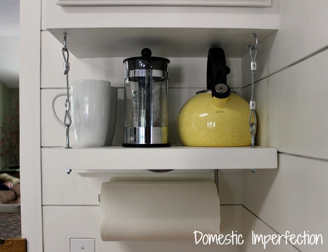 Adding a shelf underneath your kitchen cabinets for extra storage. 