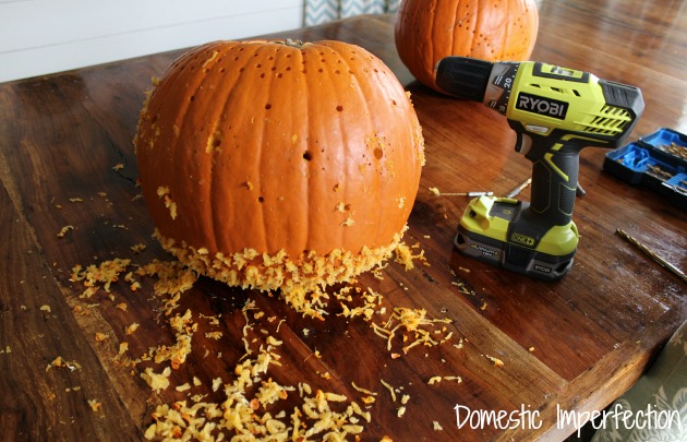 Carve a pumpkin with a drill