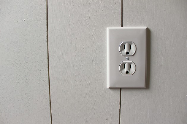 outlet over a plank wall