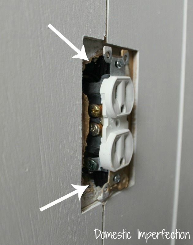 outlet on a plank wall