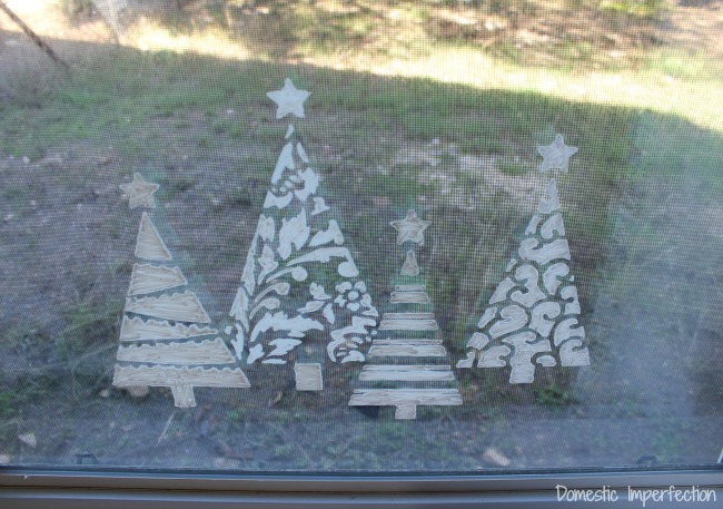 Stenciled Christmas trees on window