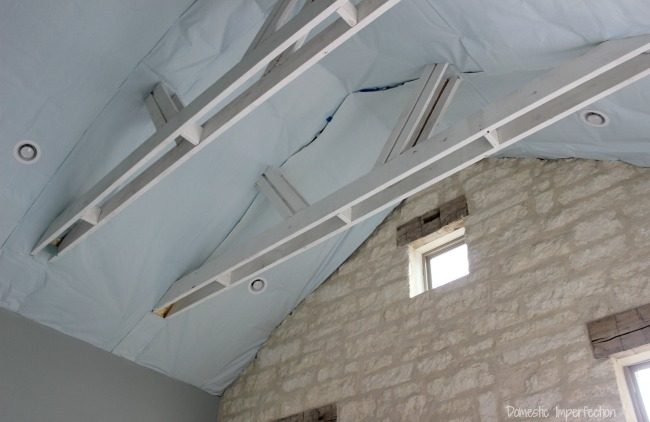 vaulted bedroom ceiling with exposed beams - before wood