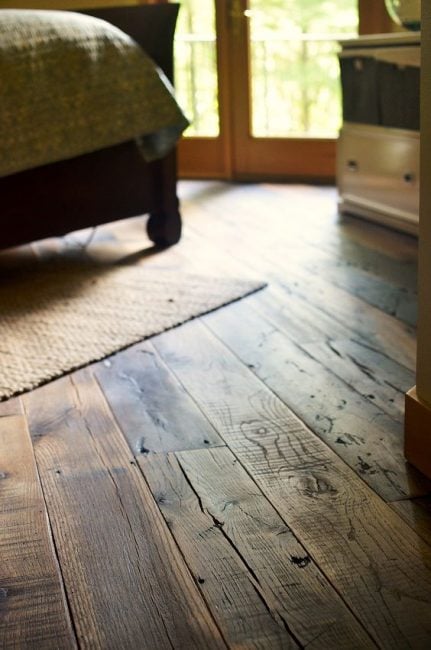 A room with a rustic wooden floor