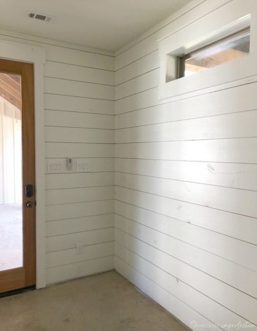 white shiplap in mudroom