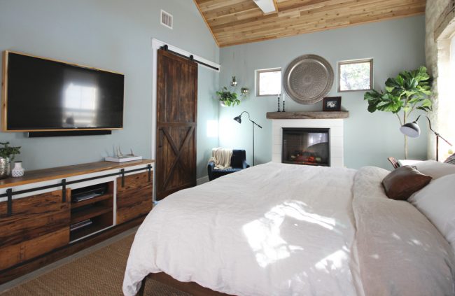 rustic master bedroom with fireplace