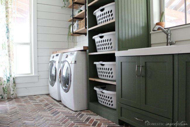 dark green cabinets in laundry room 