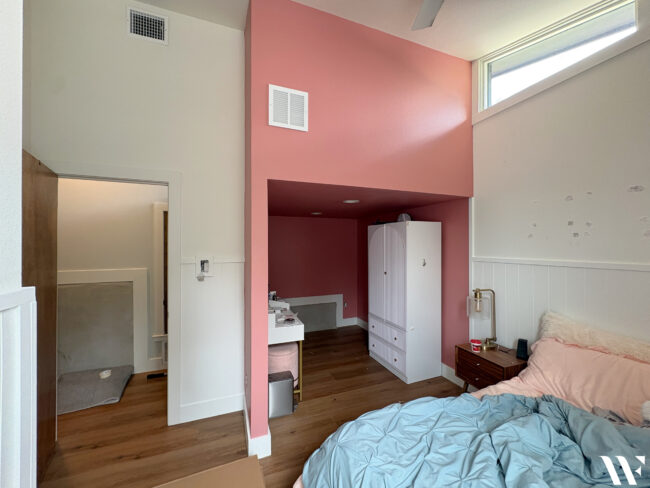 Should I make a weird feature in a room stand out or disappear?